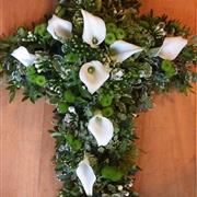 Green interspersed with white calla lilies